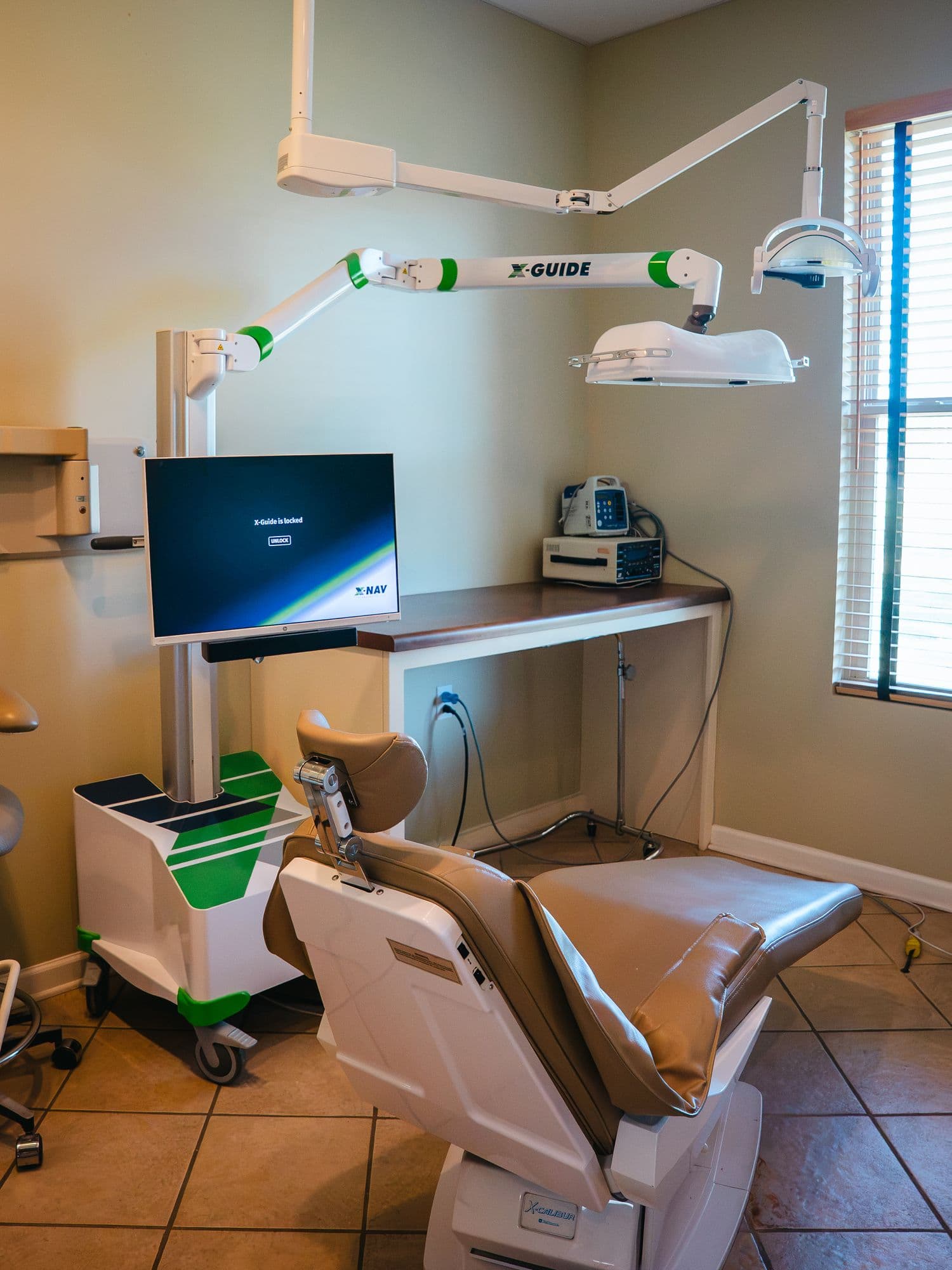 A treatment room set up with X-Guide navigation at Park Place Dental