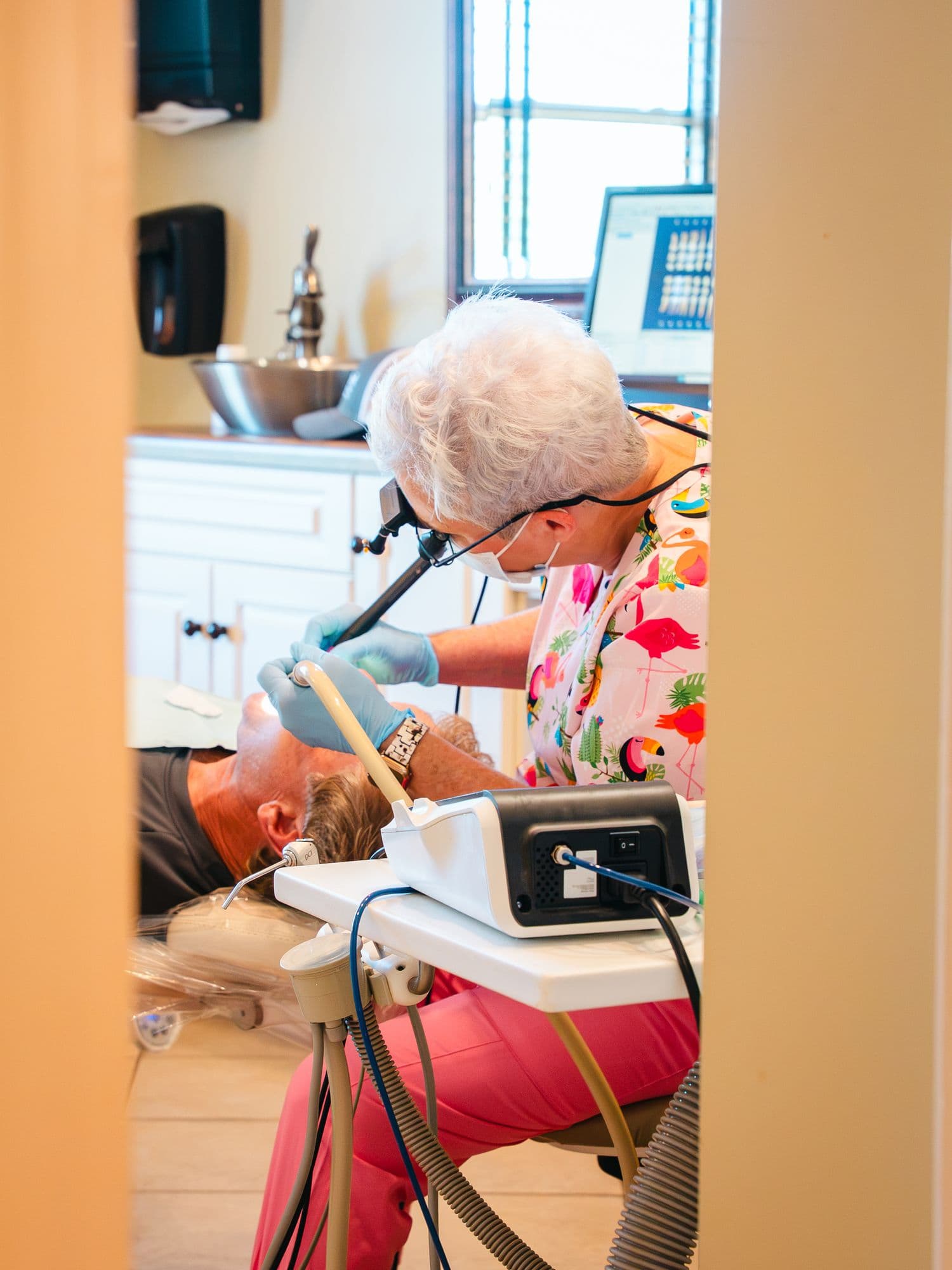 A hygienist cleaning a patient's teeth at Park Place Dental