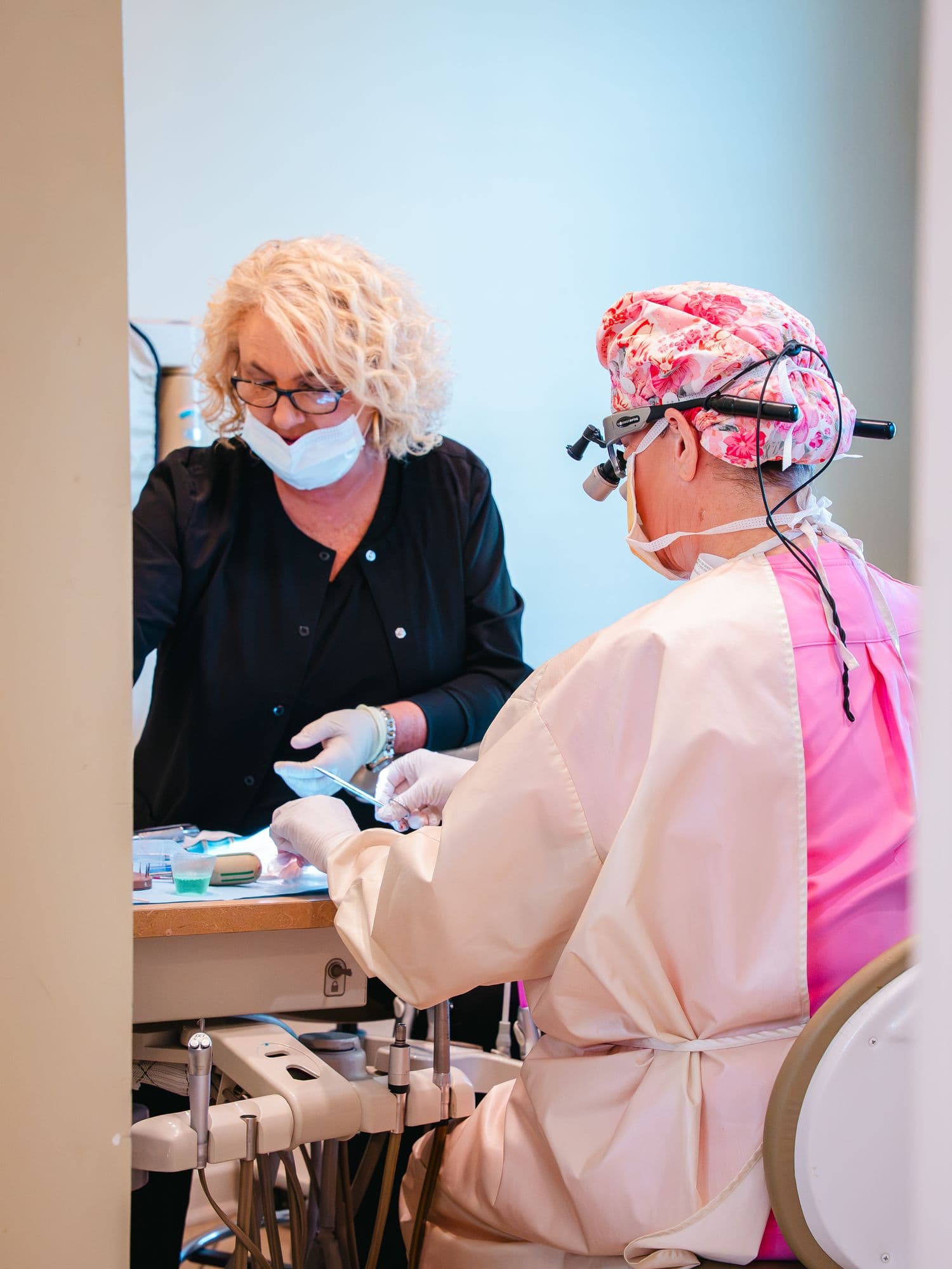Dr. Rebecca McDougald and an assistant preparing for treatment at Park Place Dental