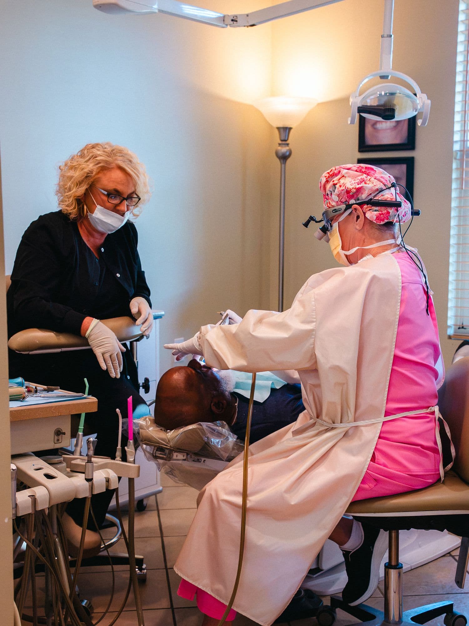 Dr. Rebecca McDougald and an assistant treating a patient at Park Place Dental