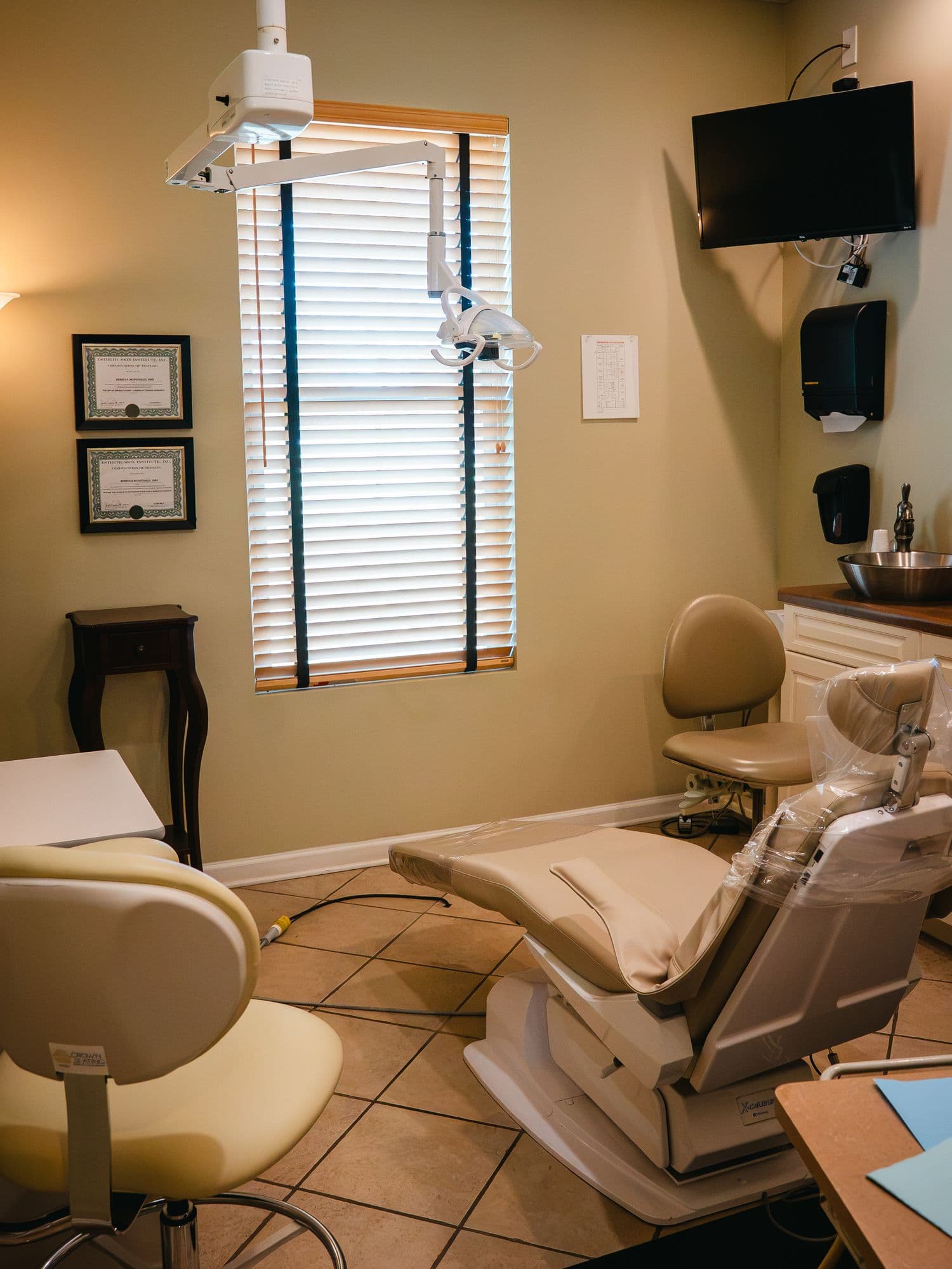 A treatment room at Park Place Dental, with framed certificates on the wall