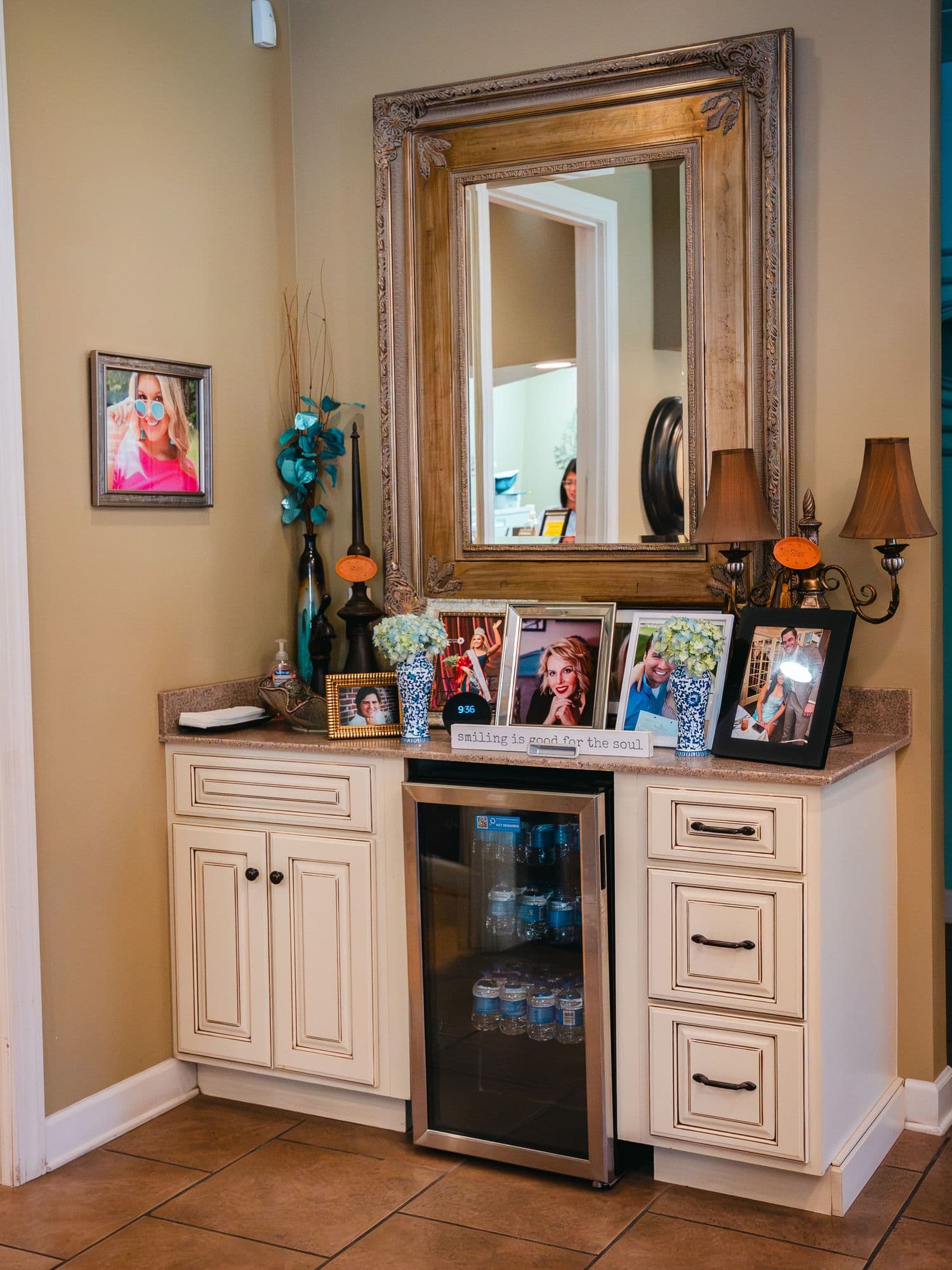 The refreshment corner at Park Place Dental, with a mirror and framed photographs