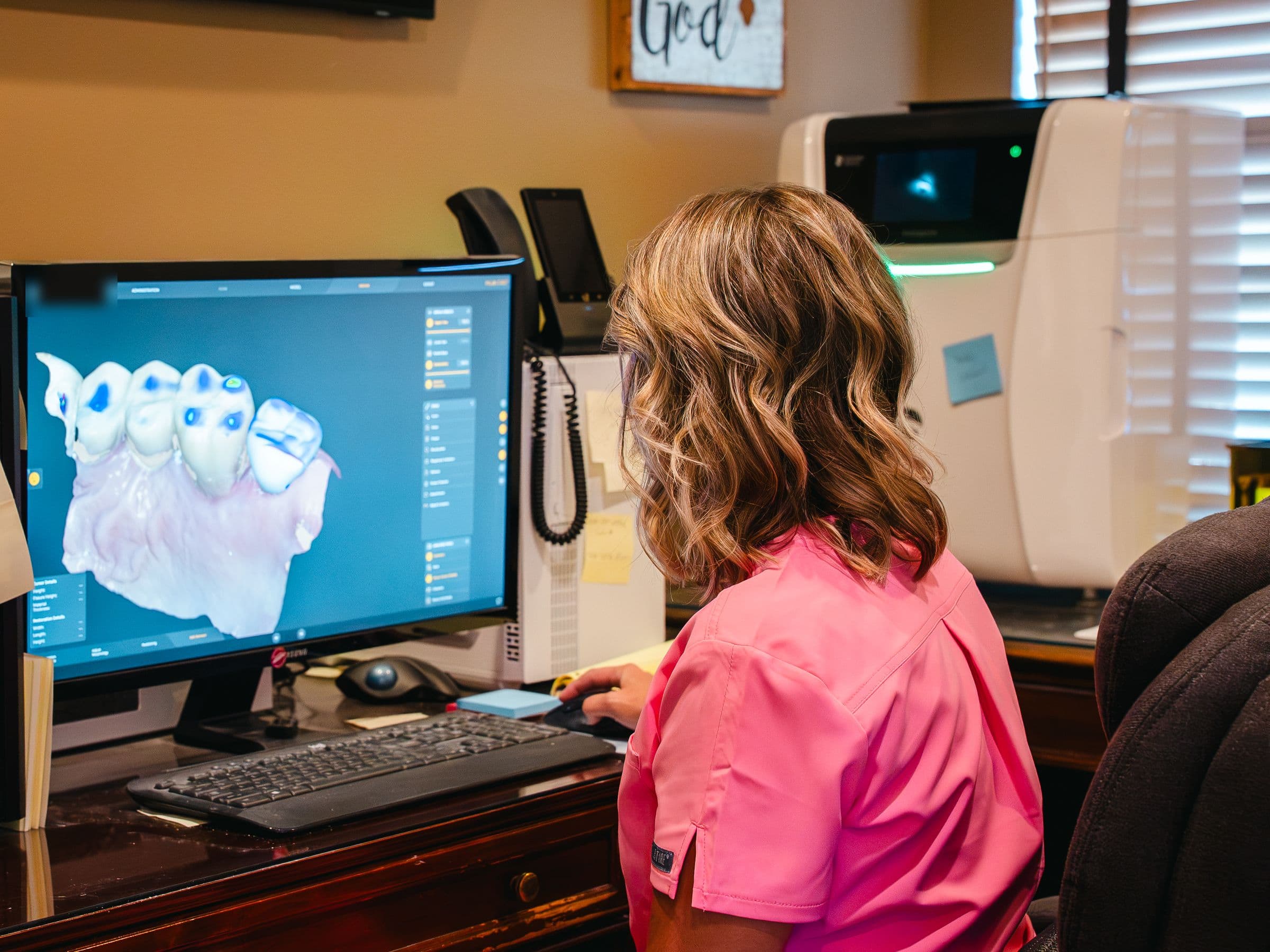 A Park Place Dental team member designing a restoration on a computer