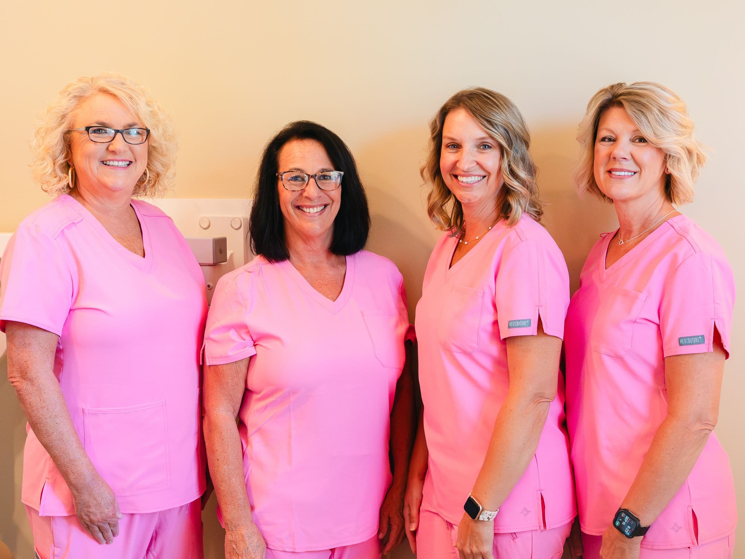 Four members of the Park Place Dental team together in the office