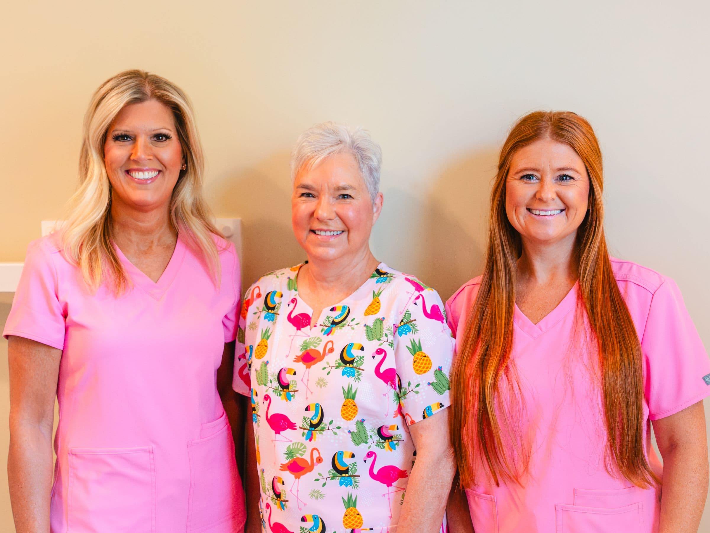 Three members of the Park Place Dental team together in the office