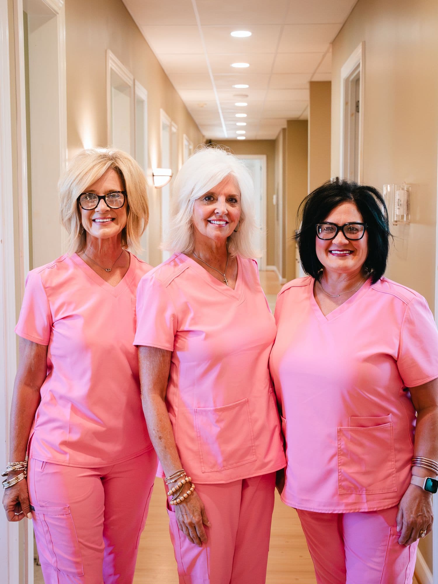Three members of the Park Place Dental team in the hallway of the Booneville practice